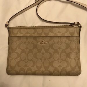 Used Coach light cream crissbody purse
